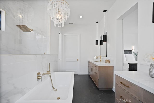 bathroom with tile patterned floors, vanity, a chandelier, and plus walk in shower