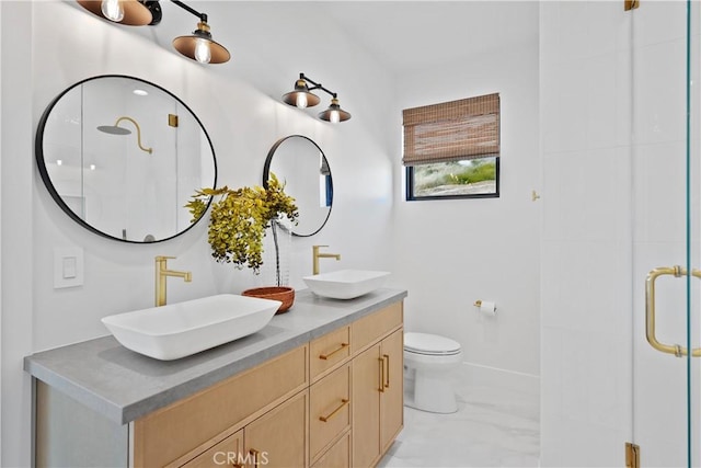 bathroom with toilet, a shower with door, and vanity