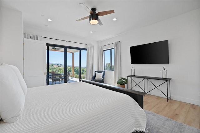 bedroom featuring ceiling fan, light hardwood / wood-style floors, french doors, and access to outside