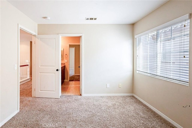 unfurnished bedroom featuring carpet floors