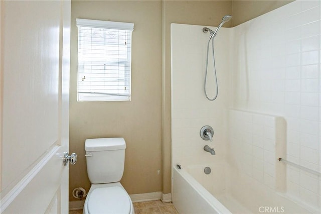 bathroom featuring toilet, shower / bathtub combination, and tile patterned floors