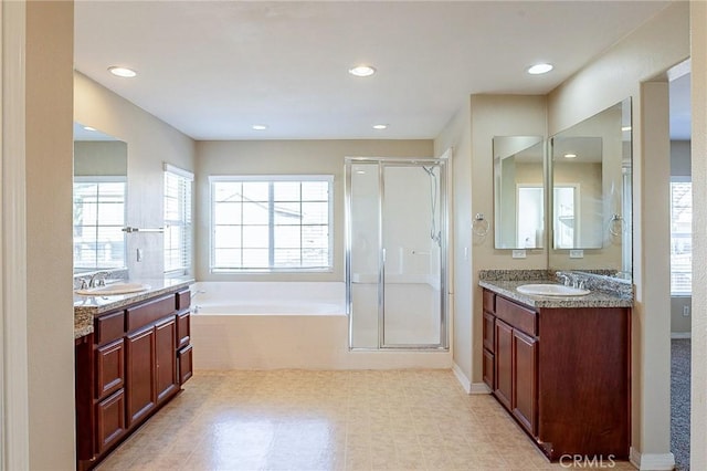 bathroom with plus walk in shower and vanity