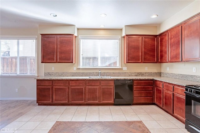 kitchen with black appliances, sink, and light tile patterned flooring