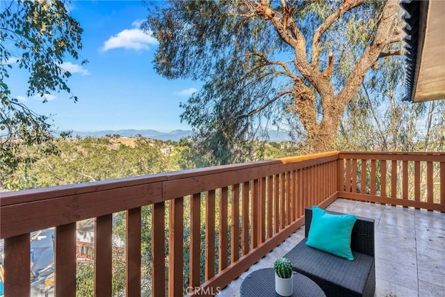 wooden deck with a mountain view