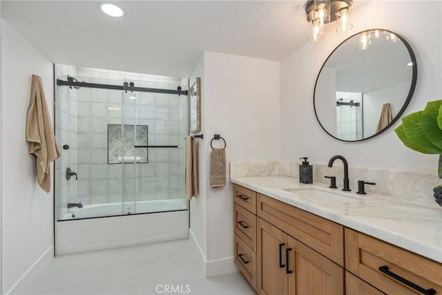 bathroom with enclosed tub / shower combo and vanity