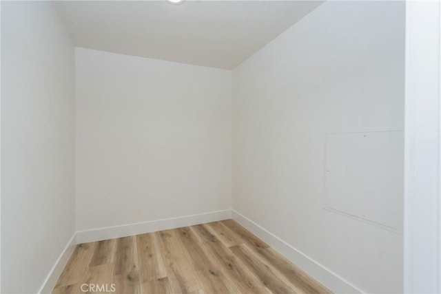 spare room with hardwood / wood-style flooring