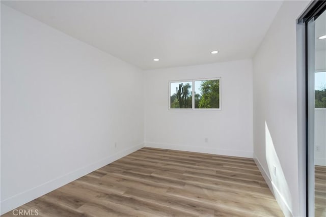 empty room with wood-type flooring