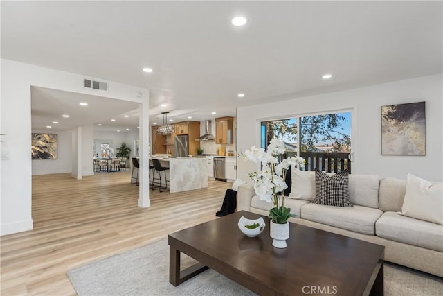 living room with light hardwood / wood-style flooring