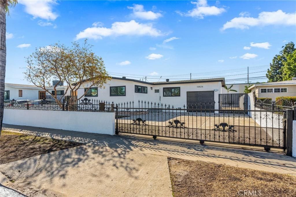 ranch-style house featuring a garage