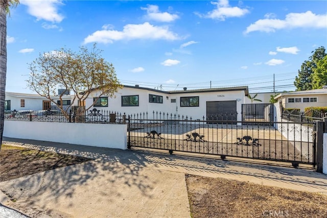 ranch-style house featuring a garage