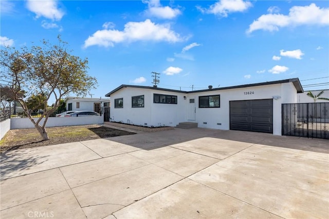 ranch-style home featuring a garage