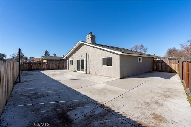 rear view of property with a patio area