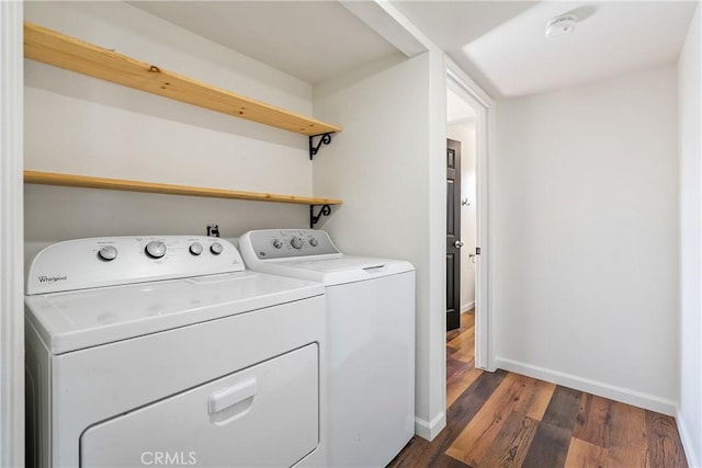 laundry room featuring dark hardwood / wood-style floors and independent washer and dryer