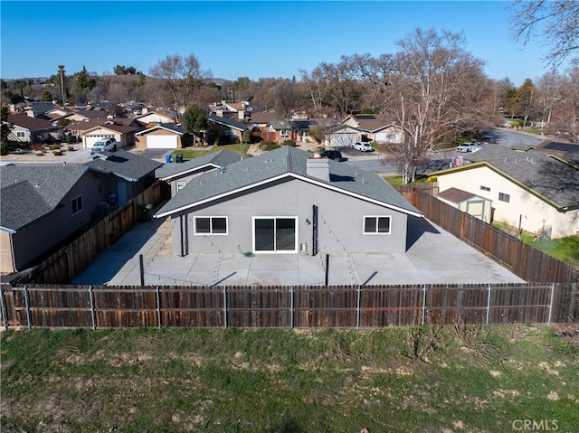 back of house with a patio