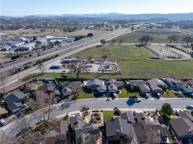 drone / aerial view featuring a mountain view