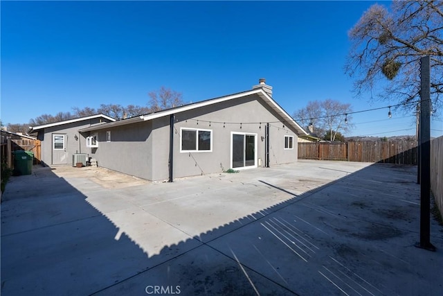 back of property featuring a patio area and cooling unit