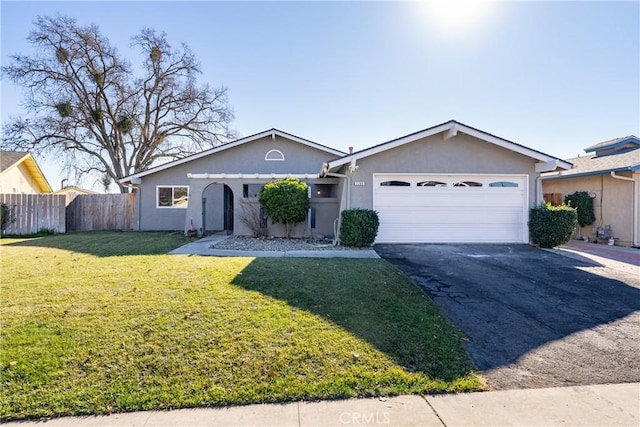 single story home featuring a front yard and a garage