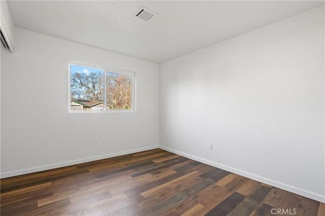 unfurnished room featuring dark hardwood / wood-style floors