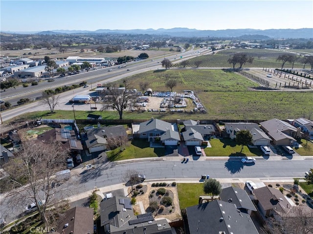 birds eye view of property featuring a mountain view