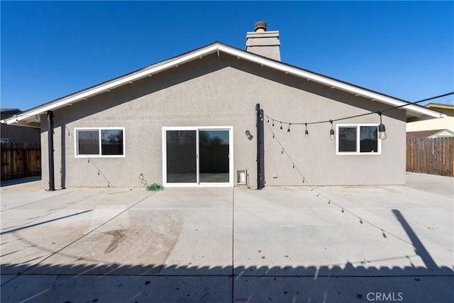 rear view of house featuring a patio area