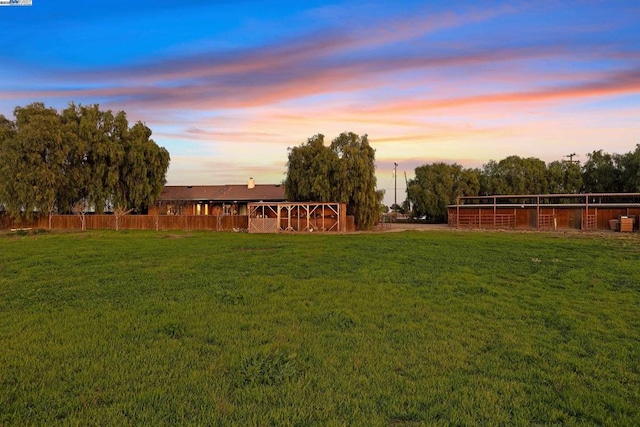 view of yard at dusk