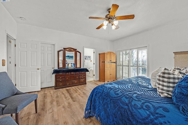 bedroom with ceiling fan, light wood-type flooring, a closet, and ensuite bathroom