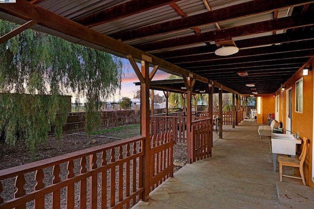 view of patio terrace at dusk