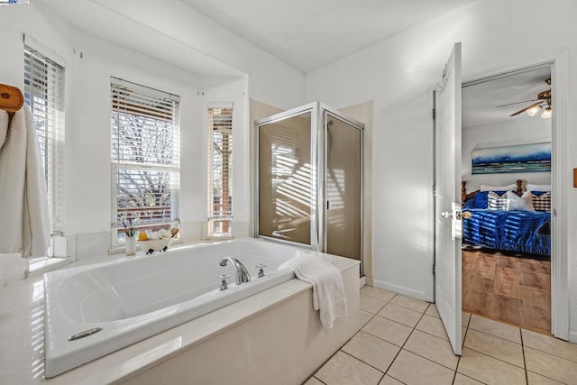 bathroom featuring independent shower and bath, tile patterned floors, and ceiling fan