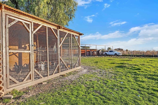 view of outbuilding with a yard