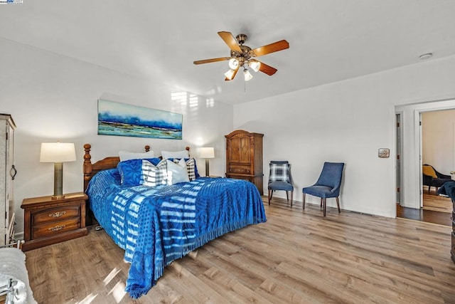 bedroom featuring ceiling fan and light hardwood / wood-style flooring