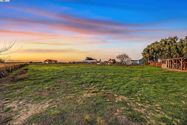 view of yard at dusk