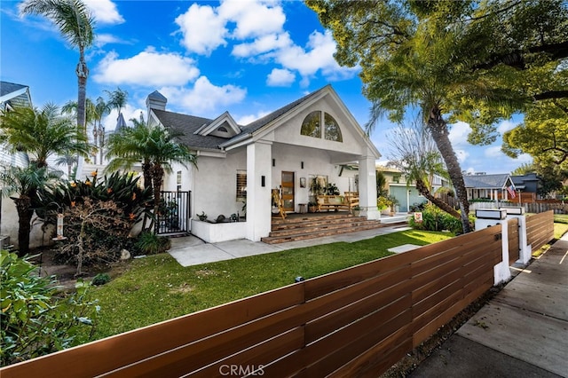 view of front of property with a front lawn