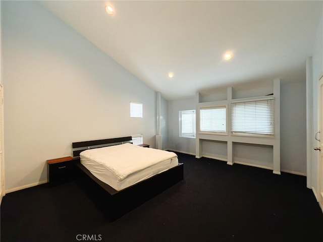 bedroom with lofted ceiling