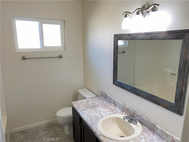 bathroom featuring toilet and vanity