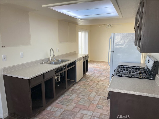 kitchen featuring ceiling fan, dark brown cabinets, sink, and stainless steel appliances