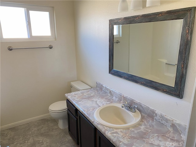 bathroom with toilet and vanity