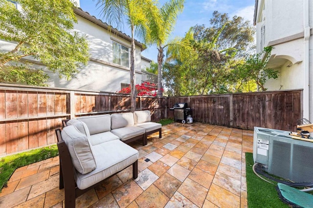 view of patio with central AC unit and an outdoor living space