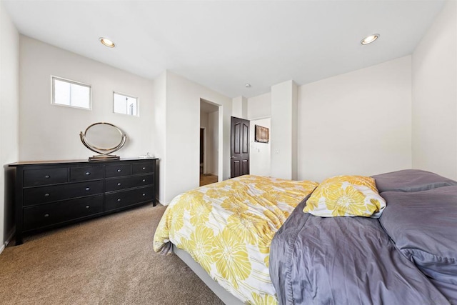 bedroom featuring light colored carpet