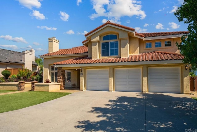 mediterranean / spanish-style house featuring a garage