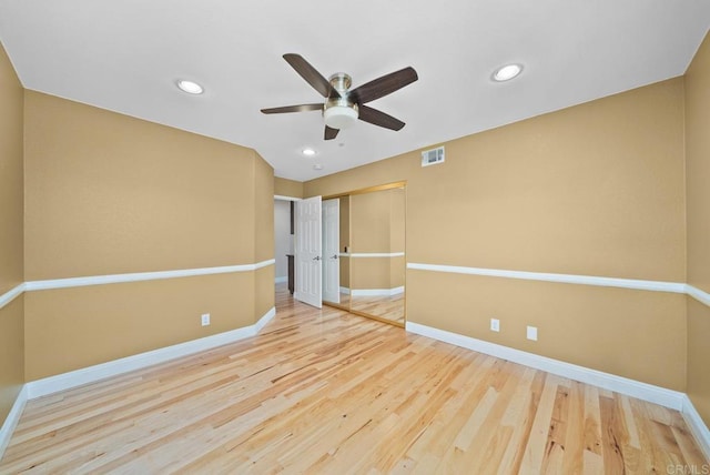 unfurnished room featuring hardwood / wood-style flooring and ceiling fan