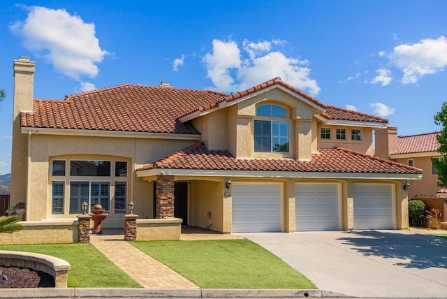 mediterranean / spanish-style house featuring a garage