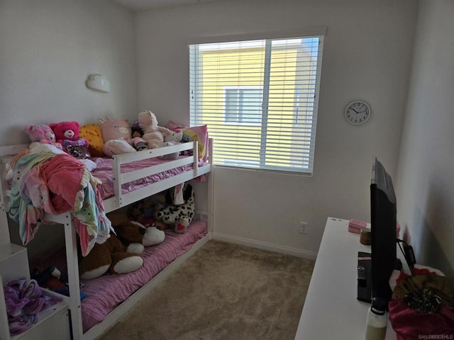 carpeted bedroom featuring multiple windows