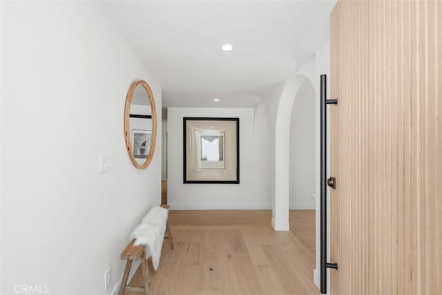 hall with light hardwood / wood-style floors