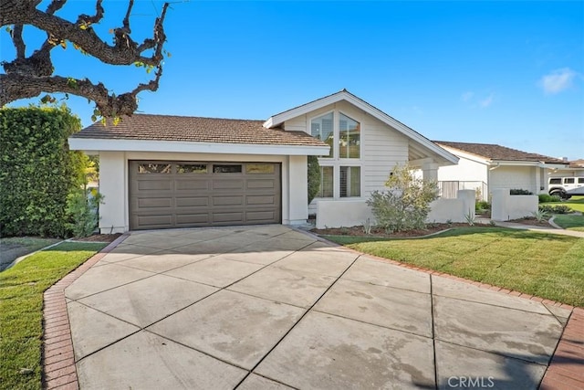 single story home featuring a garage and a front yard