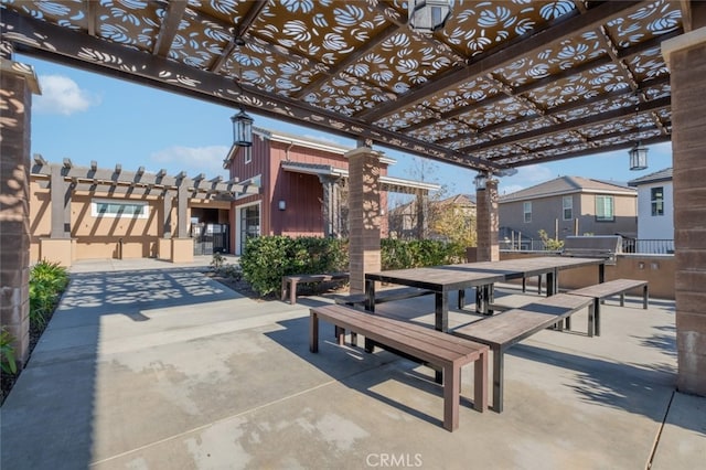 view of patio featuring grilling area and a pergola