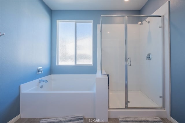 bathroom featuring plus walk in shower