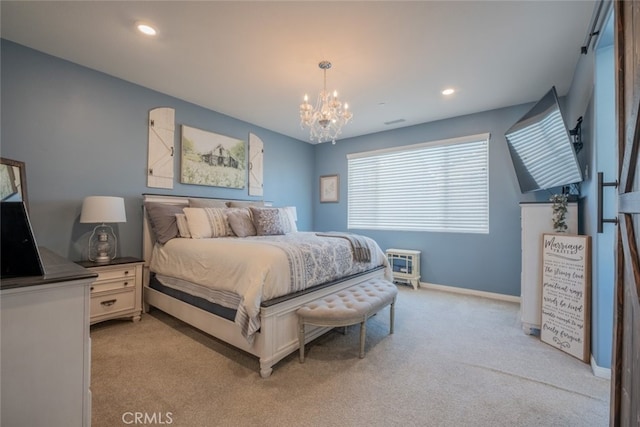 bedroom with light carpet and a chandelier