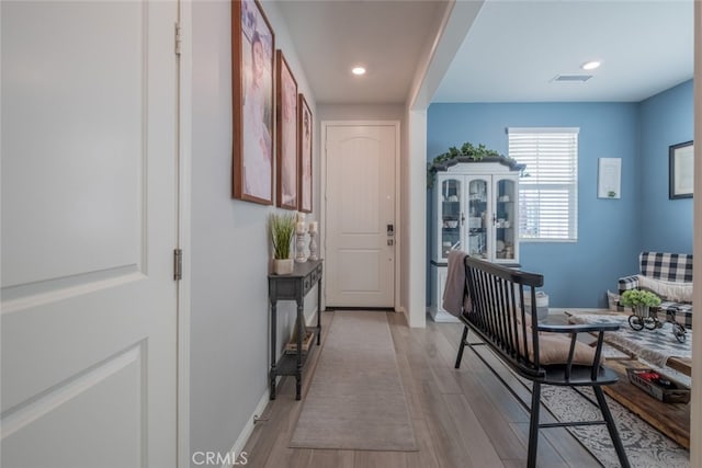 corridor featuring light hardwood / wood-style floors