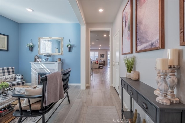 hall with light hardwood / wood-style floors