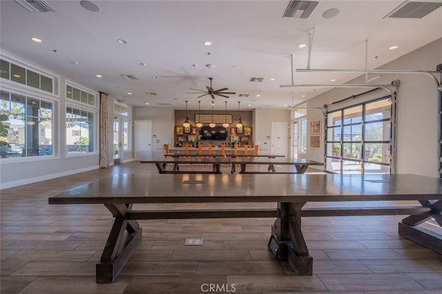 interior space with ceiling fan